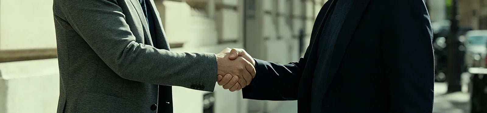 Handshake representing trust, partnership, and customer commitment for the UAMFURI About Us page