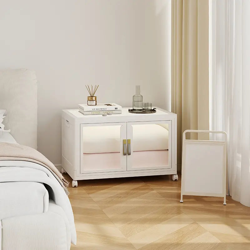 UAMFURI white clear door storage cabinet placed beside a bed as a bedside table