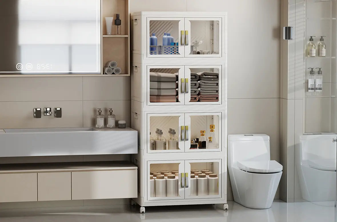 White foldable storage cabinet placed between a toilet and sink for bathroom organization